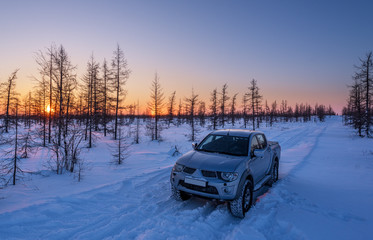 Car in the winter forest © Andrey Snegirev