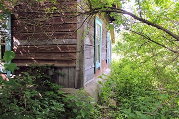 An old abandoned building, where 100 years ago lived the family of a railway inspector. The house is wooden, it is next to a railway line in Russia.