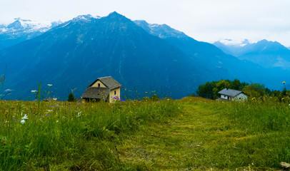Fototapeta na wymiar Residential houses in the mountains of Switzerland. Canton Tesshin