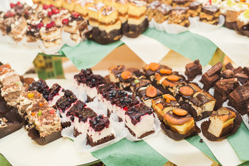 Delicious sweets on wedding candy buffet with desserts, cupcakes