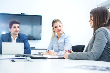 Business people in meeting in conference room.