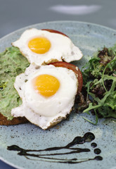 Fresh breakfest, fried eggs and salad