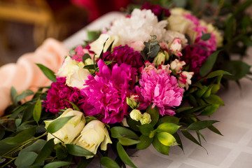 Wedding peony bouquet on table
