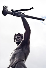 Fototapeta na wymiar Progress, one of four bronze statues around the Victoria memorial monument in London