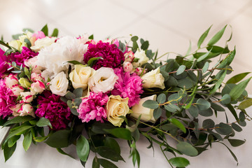 Wedding peony bouquet on table