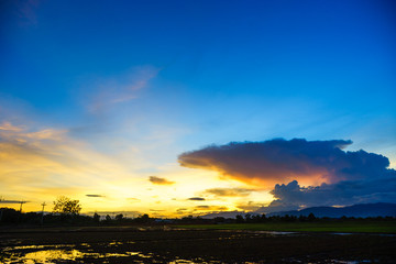 reflection of the sunset on the farm in north of thailand.