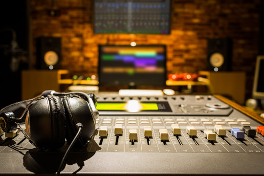 headphones on sound mixer in digital recording studio