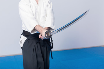 A man with katana on Iaido practice