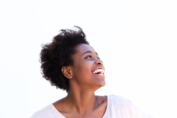 Fototapeta na wymiar Close up beautiful afro american woman laughing and looking away