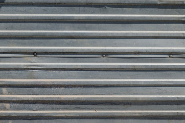 Horizontal corrugated shuttering or panel suitable as a background
