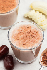Delicious creamy banana cocoa dates smoothie. Healthy delicious breakfast.