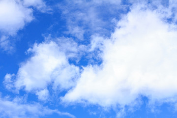 Blue sky background with white clouds, rain clouds on sunny summer or spring day.
