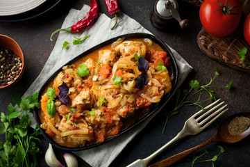 Chakhokhbili - traditional Georgian dish. Stewed chicken with tomato, onion, garlic, pepper and...