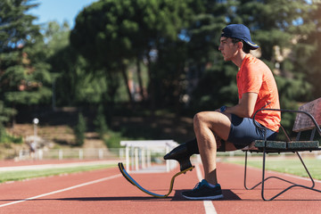 Disabled man athlete taking a break.