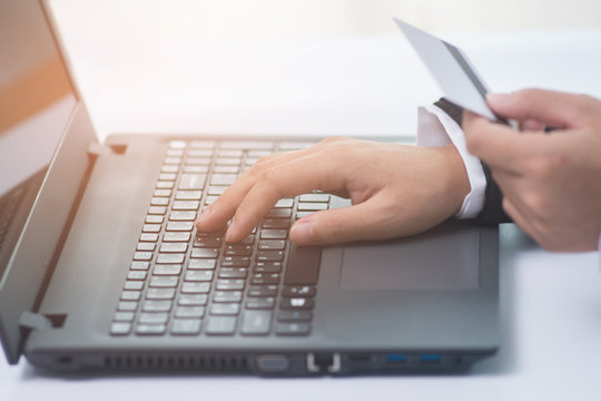 Business woman using laptop and using credit card for online shopping. Online shopping concept.