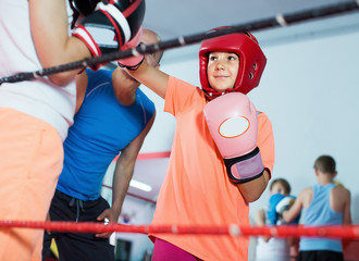 Teenagers at boxing training with coach