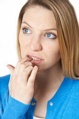 Fototapeta premium Studio Shot Of Nervous Woman Biting Nails