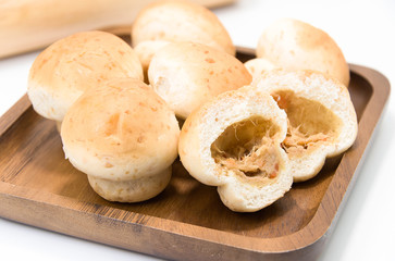 Curry bread on a wood with white background.