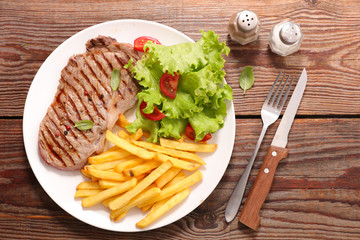 grilled steak with french fries