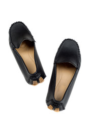 pair of black leather mackasins isolated on white background