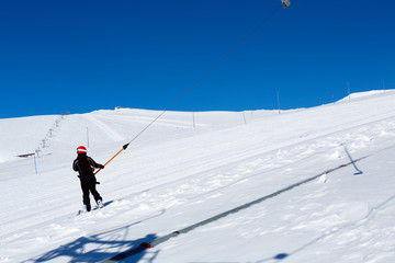 snowboarder climbs the ski lift