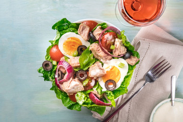 Tuna salad with rose wine, fork, sauce, and copy space