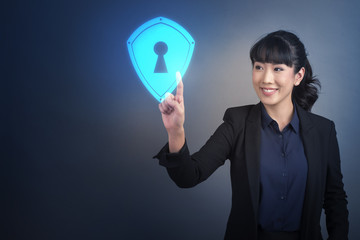 Fototapeta na wymiar Beautiful Business Woman touching Business button shield security virus symbol web sign