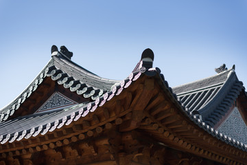 Korean traditional architecture eaves, blue sky at Gyeongbokgung Palace in Seoul, Korea.Amazing roof construcution without nail to weld the wood