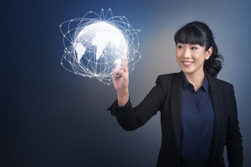 Beautiful Business Woman touching technology global communication on virtual screen