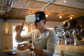 Man using virtual reality headset in restaurant