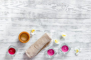 Candles for aroma relax bath on wooden table background top view copyspace