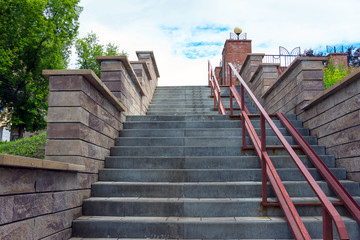 Obraz premium Granite staircase of gray color that goes up. Bottom view