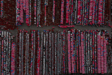 Warehouse containers in red on the street in the open air. Logistics center. Aerial view. From above