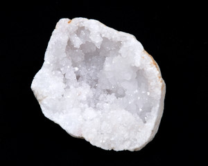 Clear crystal quartz geode with crystalline druzy center on black background