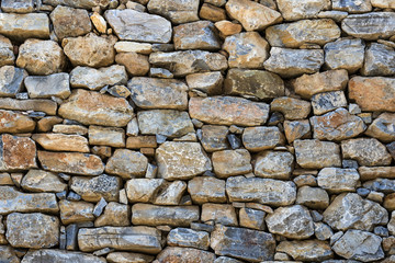 Background of an old stone brick wall shot close-up 