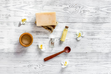 Organic skin care. Soap, gel and salt on wooden table background top view copyspace