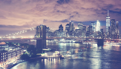 Fototapeta na wymiar Vintage toned picture of New York City skyline at night, USA.
