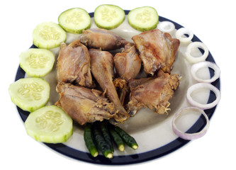 Fry Chicken with onion ring, salad and chili peppers on dish