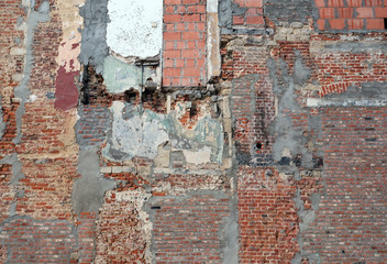 part of old derelict brick wall after demolition work