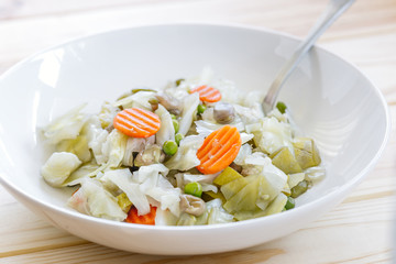 Mix of cooked vegetables on wooden table. Diet and healthy food concept. Vegetarian food