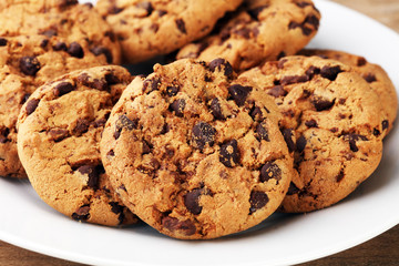 Chocolate cookies on wooden table. Chocolate chip cookies shot