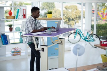 Executive working on laptop in office