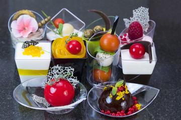 Canape desserts and snack in plastic cups 
