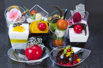 Canape desserts and snack in plastic cups 
