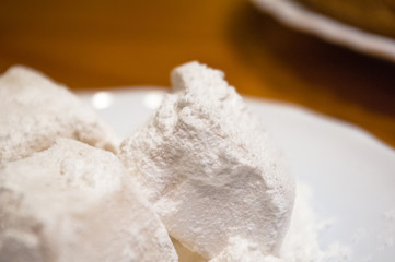 Turkish delight or rahat-lokum on a white saucer