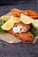 traditional British fish and chips on brown paper