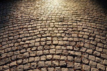 Vintage cobblestones glistening in the sun