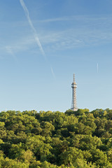 Obraz premium View of the Petrin Lookout Tower at the Petrin Hill in Prague, Czech Republic. Copy space.