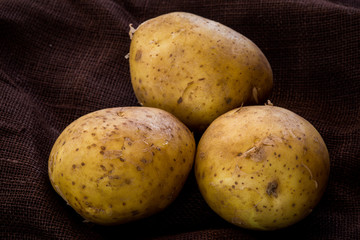 Potatoes in dark background