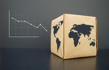 Declining graph. Printed on paper. On a wooden texture.